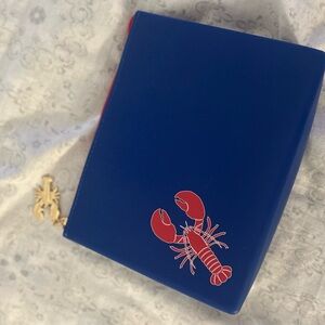 Navy blue and red crawfish make up bag with gold crawfish charm